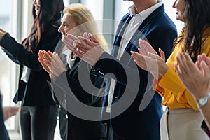 Business people clapping hands at successful presentation. Intellectual.