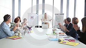 Business people clapping during a meeting