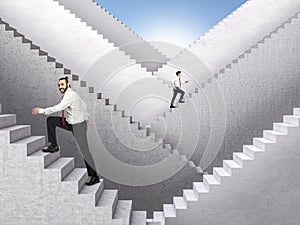 Business people climb concrete stairs leading to success