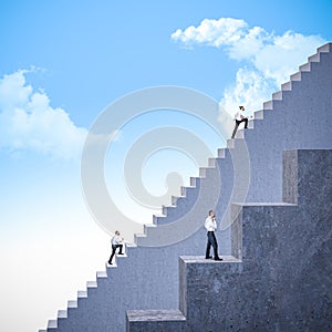 Business people climbing stairs of different sizes