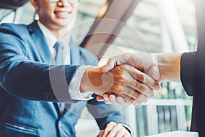 Business people colleagues shaking hands during a meeting to sign agreement for New Partner Planning Strategy Analysis Concept