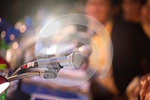 Business people or commentator in seminar room