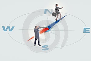 Business people with compass looking for direction