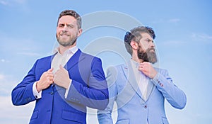 Business people concept. Well groomed appearance improves business reputation entrepreneur. Business men stand blue sky photo