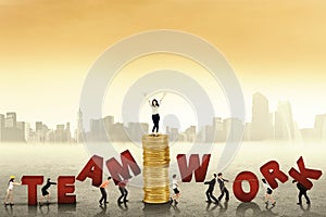 Business people creating word of teamwork