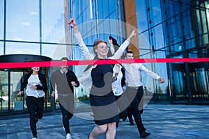 Business people crossing the finish line