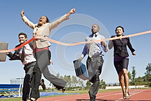 Business People Crossing The Winning Line