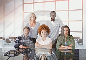 Business people at a desk looking angry