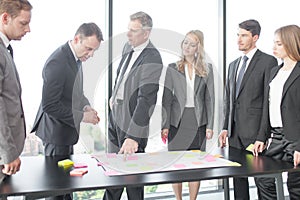 Business people developing plan on office desk