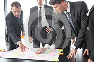 Business people developing plan on office desk