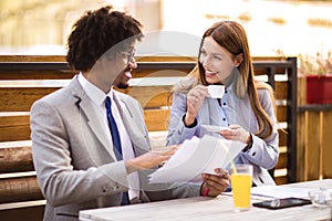 Business people discuss about the future project plan in cafe