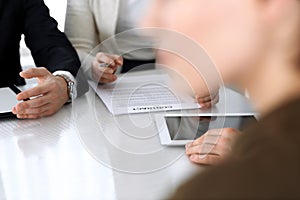 Business people discussing contract working together at meeting at the glass desk in modern office. Unknown businessman
