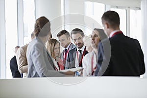 Business people discussing in convention center