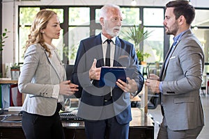 Business people discussing document on a meeting in office