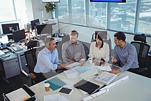 Business people discussing in meeting at office desk