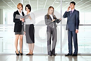 Business people discussing in a office corridor