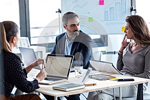 Business people discussing together in conference room during meeting at office