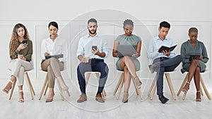 Business people, diversity and waiting room in networking or social media at the office with technology in the workplace