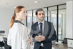 Business people drinking champagne to celebrate success.