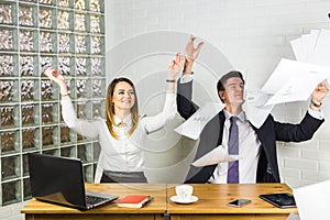 Business people excited happy smile, throw papers, documents fly in air, success team concept after sign contract