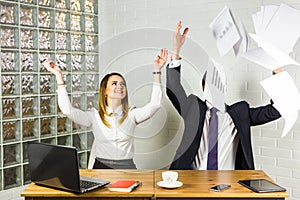 Business people excited happy smile, throwing up papers, documents fly in air, success team concept
