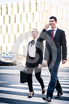 Business people in front of office building