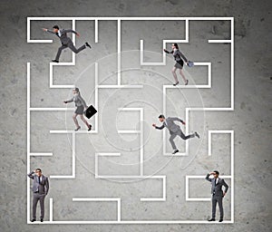 Business people getting lost in maze uncertainty concept