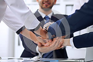 Business people group Business people group happy showing teamwork and joining hands or giving five after signing