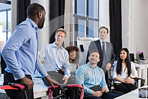 Business People Group In Creative Office, African American Businessman Hold Bicycle, Team Meeting And Communicating