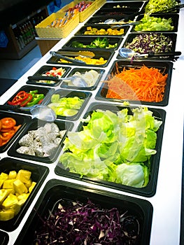 Business people group in the line catering buffet food indoor in luxury restaurant with meat colorful rice and vegetables