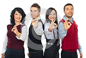 Business people group showing okay sign