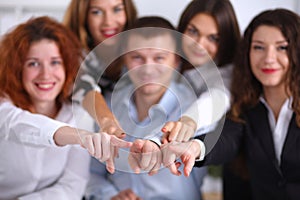 Business people group team point finger at you