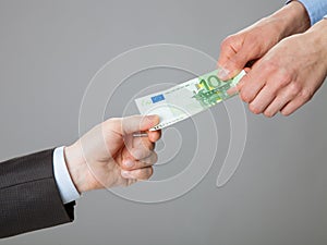 Business people hands exchanging money