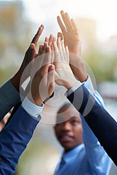 Business people, hands and high five for teamwork, success and team building. Group, collaboration and employees with