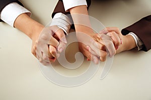 Business people with hands intertwined