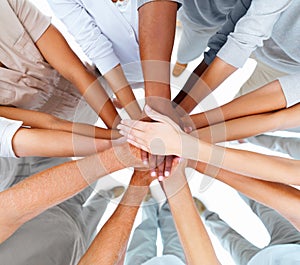Business people-hands overlapping to show teamwork