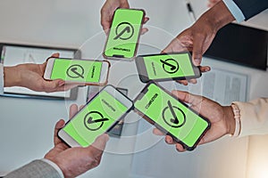 Business people, hands and phone with tick in networking, teamwork planning or sharing information. Hand of group above