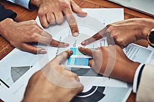 Business people, hands and pointing to document in meeting for analytics, data or company statistics at office. Hand of