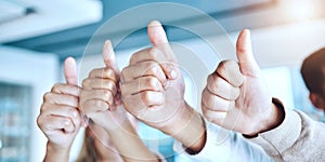 Business people, hands and thumbs up in agreement for good job, winning or teamwork success at the office. Closeup of