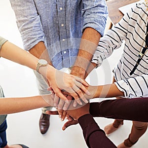 Business people, hands and unity in collaboration for teamwork, goal or diversity above at the workplace. Hand of group