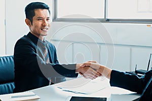 Business people handshake agreement in office. uds