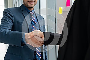 Business people handshake in corporate office