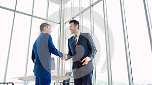 Business people handshake in corporate office