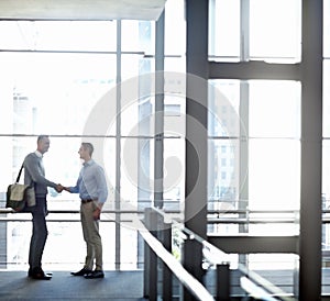 Business people, handshake or greeting in hotel lobby, modern office or airport lounge in CRM team meeting. Corporate