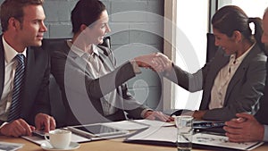 Business people handshake during meeting