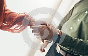 Business people, handshake and partnership in meeting, b2b deal or teamwork below at office. Low angle of man and woman