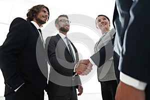 Business people handshaking after good deal.