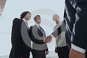 Business people handshaking after good deal.