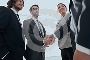 Business people handshaking after good deal.