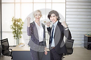 Business people are happy with business success in office